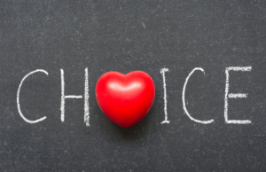 "Choice" written in bold letters with a heart in the middle, representing the concept of giving your puppy choice and autonomy for a happier and healthier life.